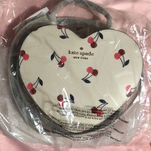 Brand new kate spade cross body heart purse comes with card wallet